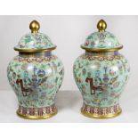A pair of Cloisonne covered vases, turquoise ground decorated all round with precious items and