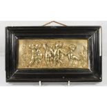 A 19th Century bronze plaque signed Augustus Moreau depicting cupids - 3 1/4in. x 7 1/4in., framed