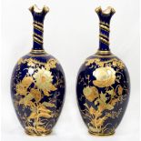 A pair of Royal Crown Derby ovoid vases with tapering necks, gilt decorated crimped rims, deep