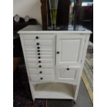 A white painted dentists cabinet fitted ten drawers and two cupboards, shelf under - 30in. wide