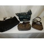 A small Fendi handbag, a small DKNY handbag, a Gianni Versace black bag and a Karen Millen handbag