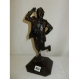 A bronzed resin statue of the Eric Morecambe Sunshine statue by Graham Ibbotson presented to