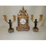 A 19th Century French mantel clock retailed by Le Roy Paris, white enamel dial with swag decoration,