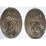 A pair of oval bronze plaques in the Art Nouveau style depicting a classical lady with stylised