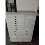 A white painted dentist's cabinet fitted eleven drawers and four cupboards - 34in. wide