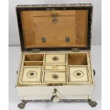 A 19th Century ivory and vizagapatam sewing box of sarcophagus form, the lid with initials and