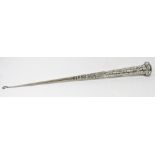 A Continental silver parasol handle with leaf scroll and hammered decoration converted to a button