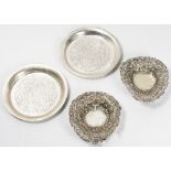 Two heart shaped silver bon bon dishes with pierced decoration and two small Islamic design