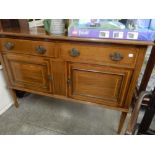 An Edwardian mahogany and satinwood crossbanded sideboard fitted two frieze drawers, two doors