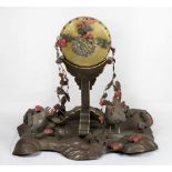 A Japanese bronze and silver okimono, the base decorated with leaves, chickens and cockerel -