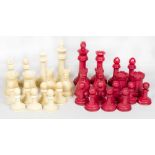 A stained ivory chess set, a turned wood chess set, one other wooden chess set and a wooden chess