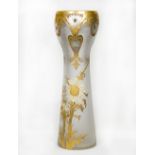 A Continental vase of tapering mottled form, the neck decorated in gold and silver with flowers