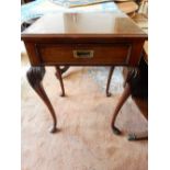 A mahogany sidetable fitted frieze drawer, on cabriole legs with leaf carved knees