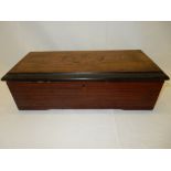 A small 19th Century musical box in a rosewood and ebonised case