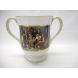 A 19th Century Prattware double handled cup decorated to each side in reserves with figures seated