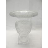 A large Lalique urn form vase with frosted band of decoration of leaves, on square pedestal base -