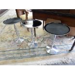 Three matching Conran chrome tables with circular tops, on turned columns and circular bases and a