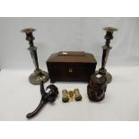 A 19th Century mahogany tea caddy of sarcophagus form, on pill feet, a carved wood nutcracker in the