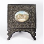 A painted miniature on ivory depicting stone arches, in a carved wood frame wiht easel back - 1 1/