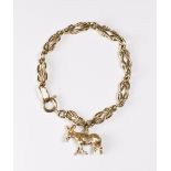 A 9kt. gold bracelet with 9ct. gold donkey charm