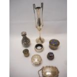 A silver specimen vase, a repousse decorated silver pepper pot, a circular silver box, a silver wine