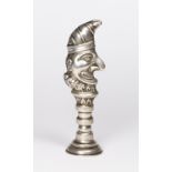 A silver seal in the form of Mr Punch - 2 1/2in. long - Birmingham 1904, makers mark for Henry