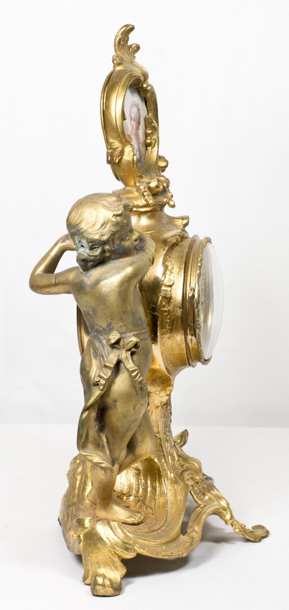 A 19th Century mantel clock with white enamel dial, in a gilded spelter case, the top inset portrait - Image 3 of 5