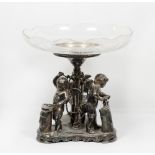 A Wilcox silver plated centre piece with etched glass bowl, the stand with three cupid supports as