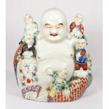 A Chinese Republic model of a seated laughing Buddha in floral decorated robes with five boys,