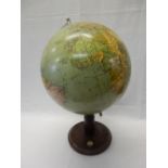 A globe on a mahogany stand