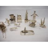 Ten Chinese silver models of pagoda, two rickshaws, throne style chair, two insects, junk etc..