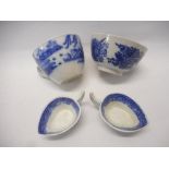 A pair of 19th Century miniature blue and white china sauce boats transfer decorated in the