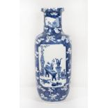 A Chinese rouleau shaped vase, blue ground decorated precious items in reserves, prunus flowers