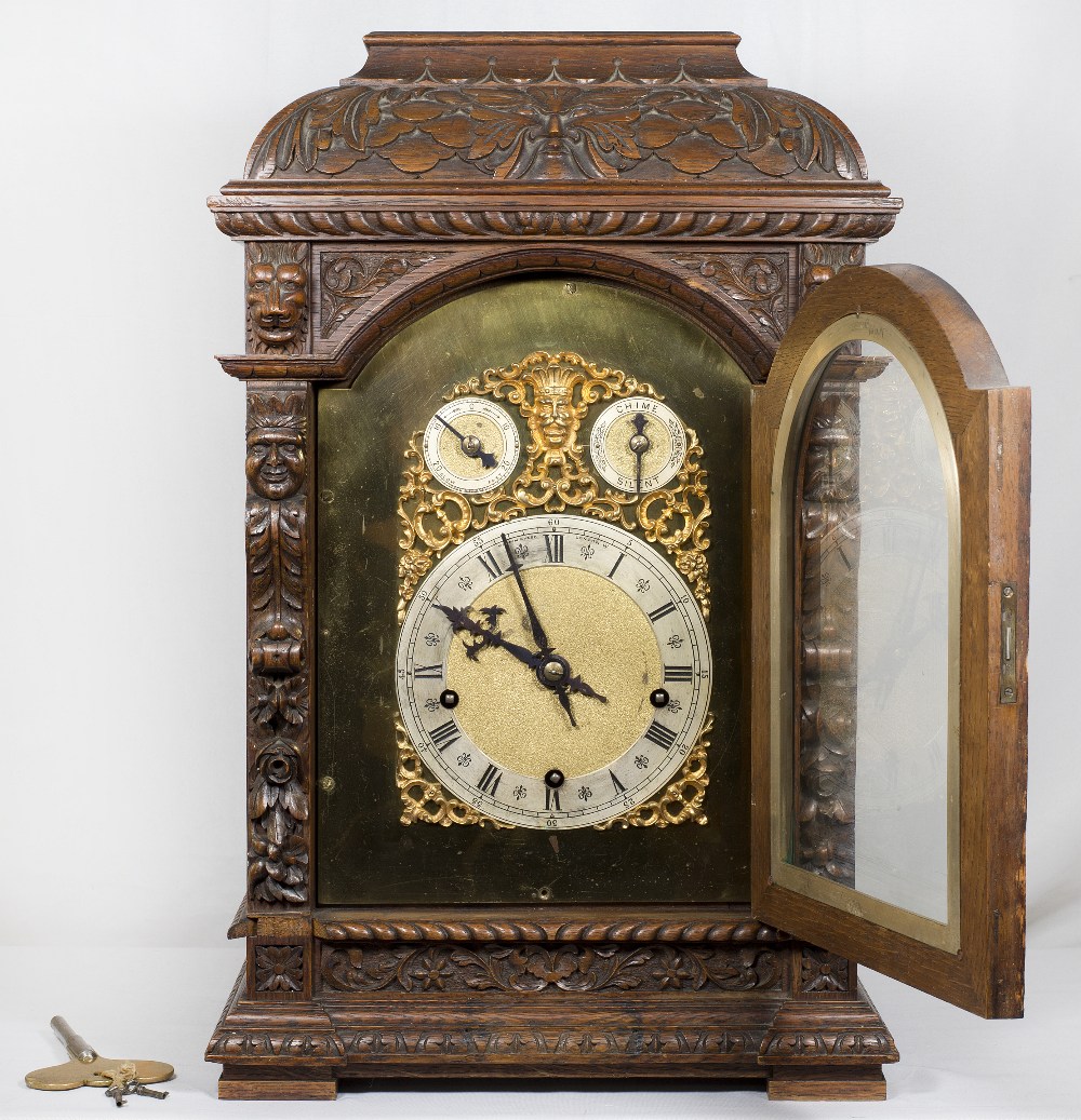 A Victorian bracket clock with arched brass dial pierced to mask design, silvered chapter ring, - Image 5 of 5