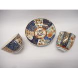 A First Period Worcester small tea cup and saucer decorated with panels of flowers in the Imari