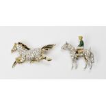 An 18ct. white gold brooch in the form of a horse and jockey, the horse pave set diamonds with one