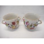 A pair of Meissen style porcelain double handled pots with flower encrusted decoration - 5in. high