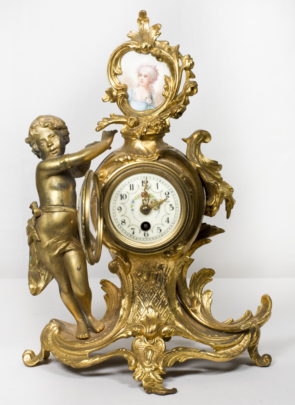 A 19th Century mantel clock with white enamel dial, in a gilded spelter case, the top inset portrait - Image 2 of 5