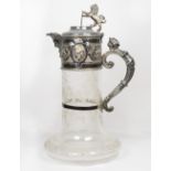 A Victorian glass claret jug with etched decoration, silver plated mounts with lion and shield