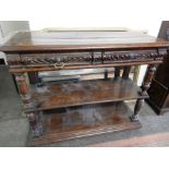 A Victorian oak buffet fitted two frieze drawers, on turned supports, two shelves under - 45in,.