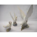 A Lladro figure of a bird on a flowering branch - 11 1/4in. high, a Nao model of a swan and a