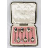 A set of six silver coffee spoons with engraved floral decorated handles - Sheffield 1915