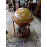 A reproduction cocktail cabinet in the form of a globe, on stand