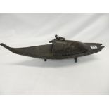 An Eastern bronze model of a boat with detachable roof, raised on four supports - 19in. wide
