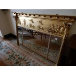 A 19th Century gilt framed overmantel with angels and classical figures to the frieze, fluted