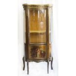 A French style vitrine with marble top, pierced gilded gallery, serpentine glass door with Vernis