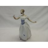 A Lladro figure of a girl in white evening dress with a butterfly on her hand - 12in. high