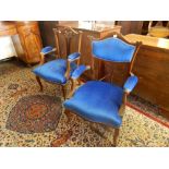 Two Victorian walnut framed armchairs with shaped cresting rails, pierced centre splats, upholstered