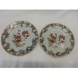 Two Chinese 18th Century porcelain plates painted in famille rose enamel to the centre with