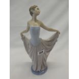 A Lladro figure of a girl in pink and blue dress - 12in. high